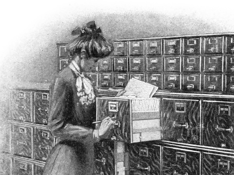 Illustration of a woman using a Macey vertical filing cabinet, from a 1903 catalogue