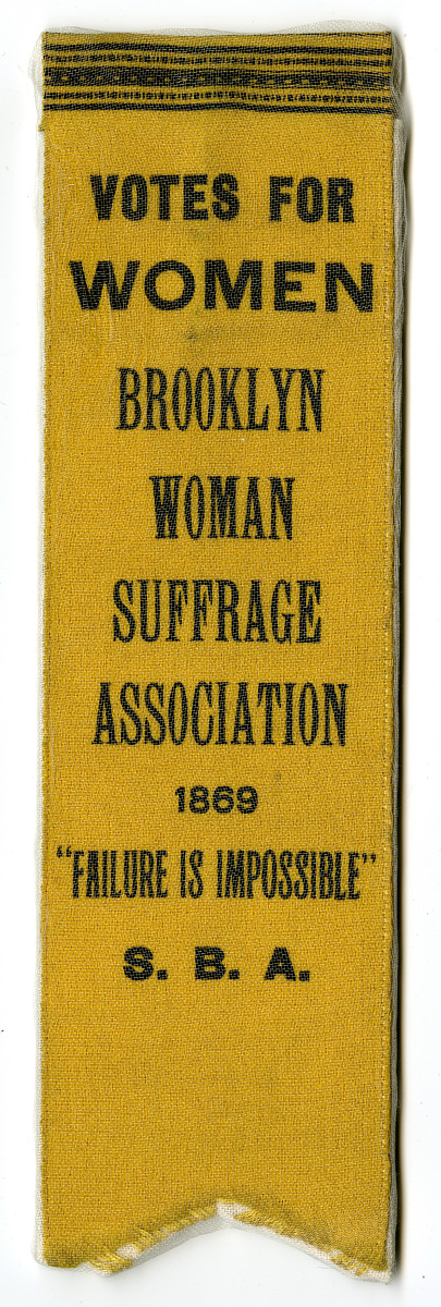 Scanned image of suffragette ribbon that reads, "Votes for Women — Brooklyn Woman Suffrage Association — 1869 — 'Failure Is Impossible' — S. B. A."